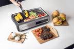 Indoor Smokeless Grill 1500W with Smart LED Touch Screen, Tempered Glass Lid, 2 Removable Ceramic Nonstick Grill & Griddle Plate, in a Modern Stainless Steel Design.