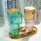 ANOTION Colored Glass Cups with Handle Set of 4, 24oz Glass Cups with Lids and Straws Travel Coffee Mug Bamboo Mason Jar Iced Cup Smoothie Tea Clear Cute Water Drinking Jars Glasses