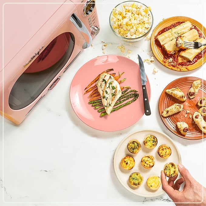 Nostalgia NRMO11PK6A 1000 Watt Power Retro Countertop Microwave Oven Easy to Clean with Removable Glass Turntable-Child Safety Lock-12 Programs-Digital Clock, 1.1 Cu. Ft, Pink