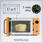 Nostalgia Retro Compact Countertop Microwave Oven 0.7 Cu. Ft. -700-Watts with LED Digital Display-Child Lock-Easy Clean Interior-Orange
