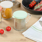 Restaurantware RW Base 10 Ounce Clear Plastic Dredge Spice Shaker 1 Reusable Dry Rub Shaker - Includes Green Perforated Lid With Handle Clear Polycarbonate Spice Shaker For Fine Seasonings