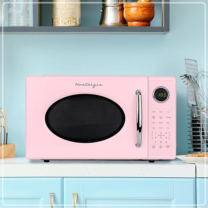 Nostalgia Retro 1000W Microwave Oven 1.1 Cu Ft Capacity – Child Safety Lock, 8 Auto-Cook Settings – Countertop Kitchen Appliance – Pink
