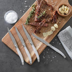 French Home Laguiole 4-Piece Steak Knife Set – Sophisticated Stainless Steel Dinner Knives with Pearlized White Handles & Iconic Bee Emblem – Serrated Knives for Smooth Cutting (9.25")